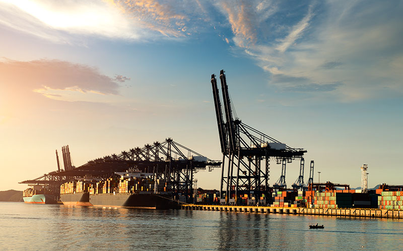 A container terminal with a ship docked.